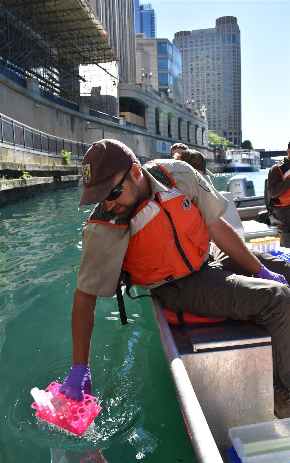A technician performing water sampling as part of an environmental assessment
